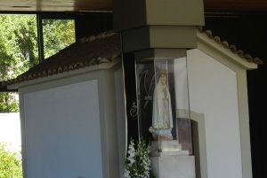 Inside the Chapel of Apparitions, a statue of Mary marks where the three children said the Blessed Mother spoke to them.