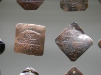 Little bits of metal served as licenses that permitted enslaved men and women to hire out their own time. Their earnings were shared with their owners.